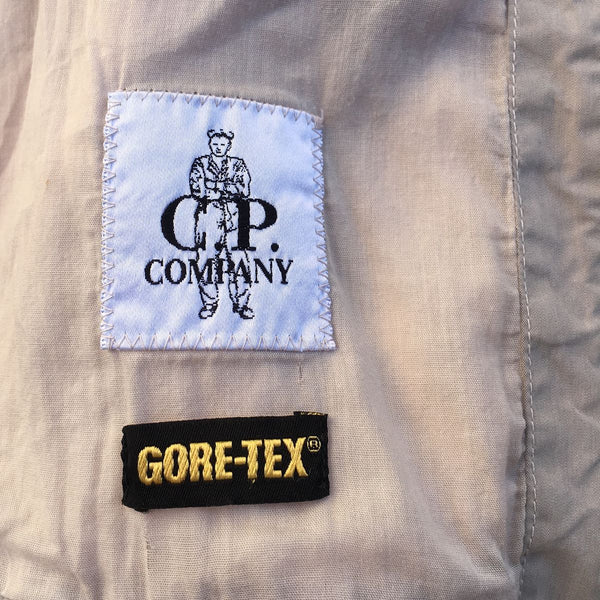cp company and gore tex logos