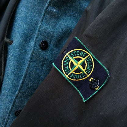 green edged stone island badge on raso gommato jacket