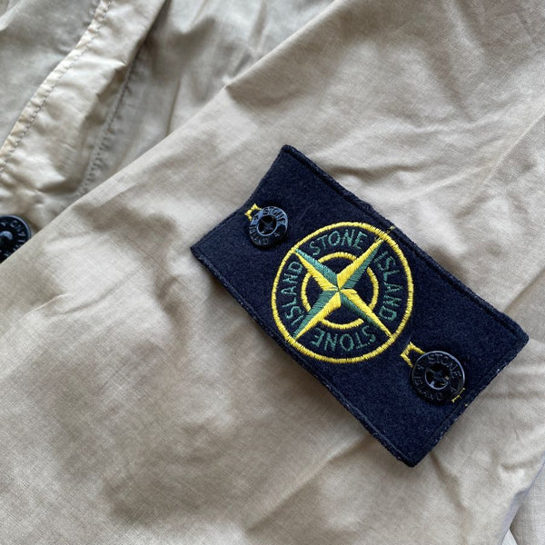 stone island badge on mussola gommata fabric
