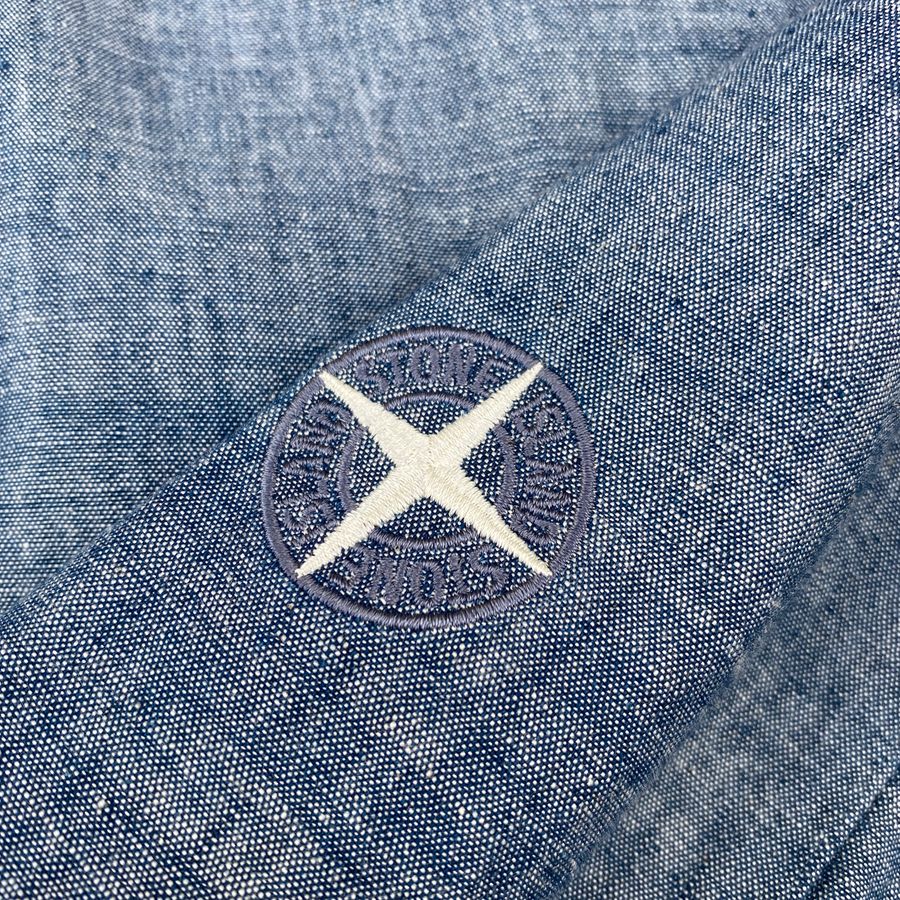 embroidered compass logo on chambray stone island shirt