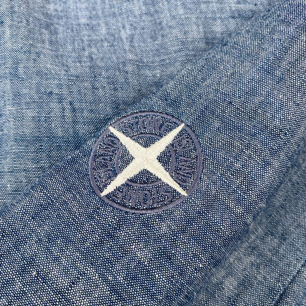embroidered compass logo on chambray stone island shirt
